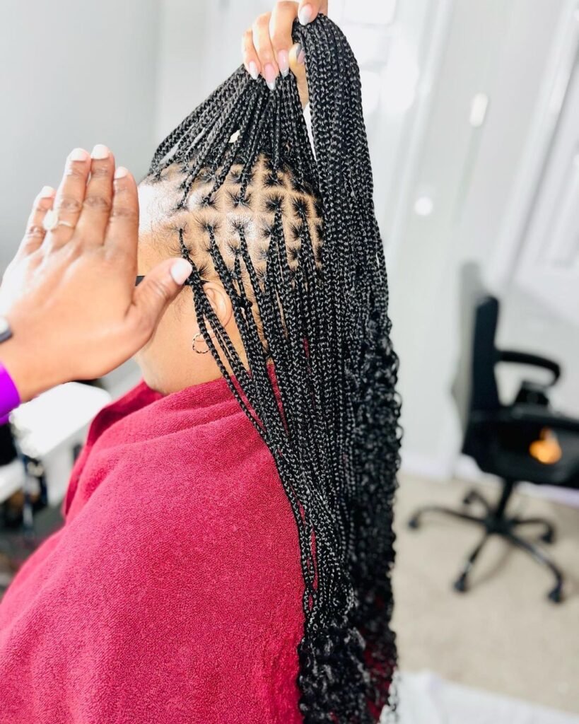 Box braids with curly ends 
